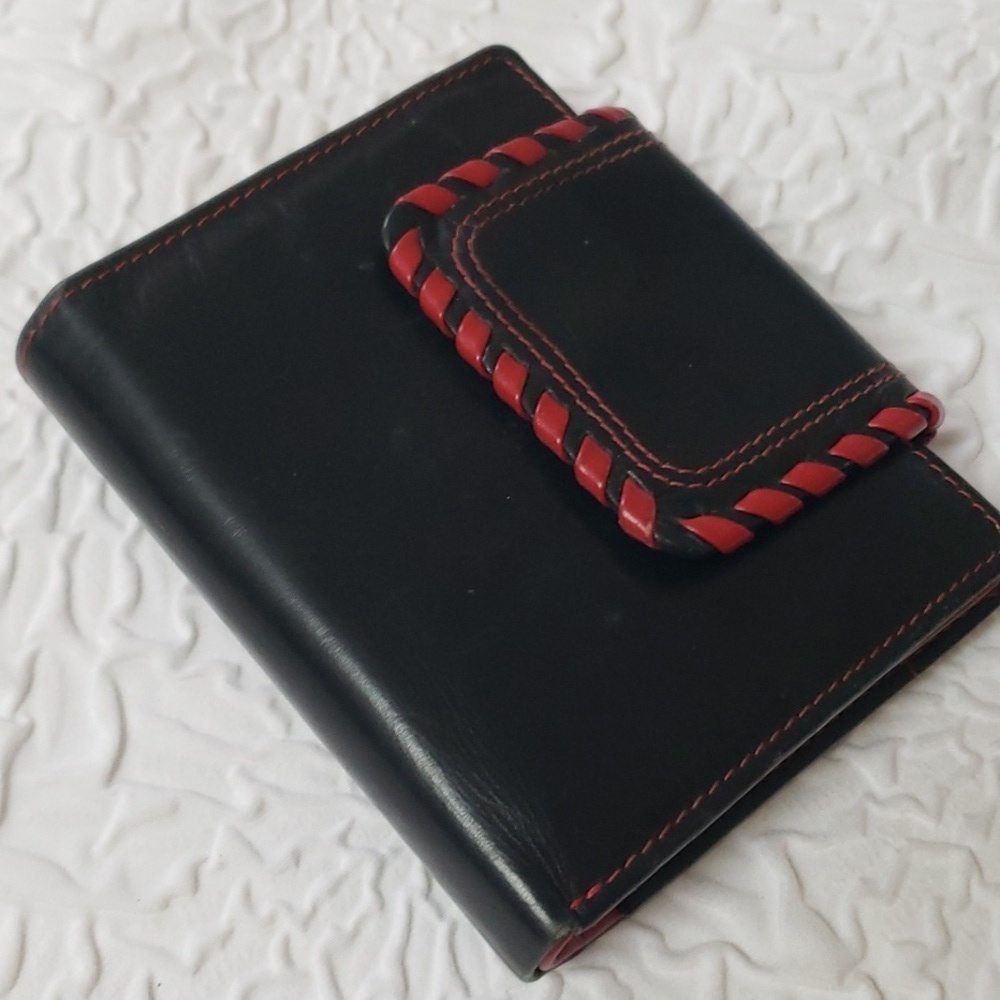 Women's trifold leather wallet with red trim and Leopard lining.